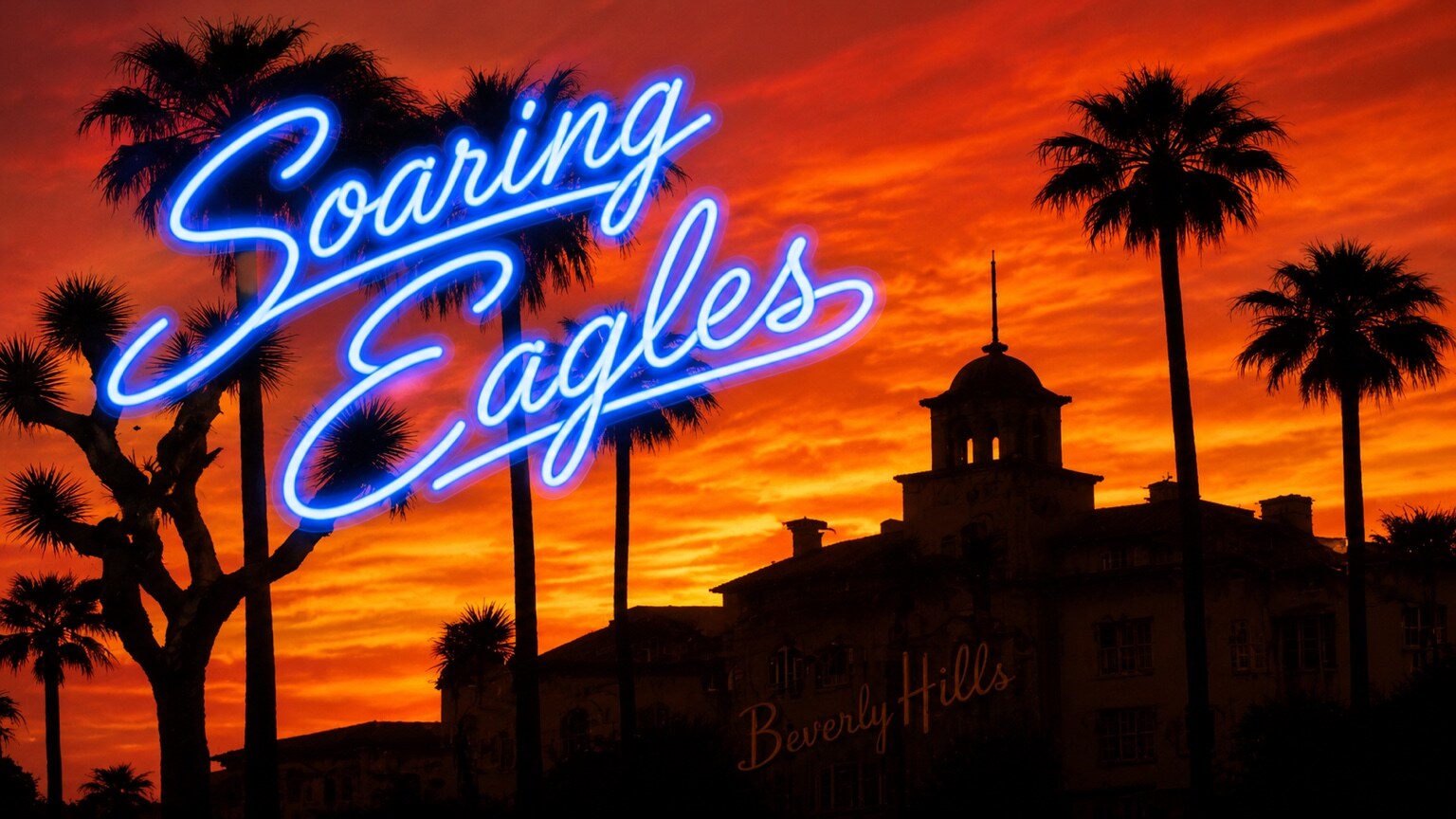 Beverly Hills hotel and palm trees beneath a vivid orange sunset